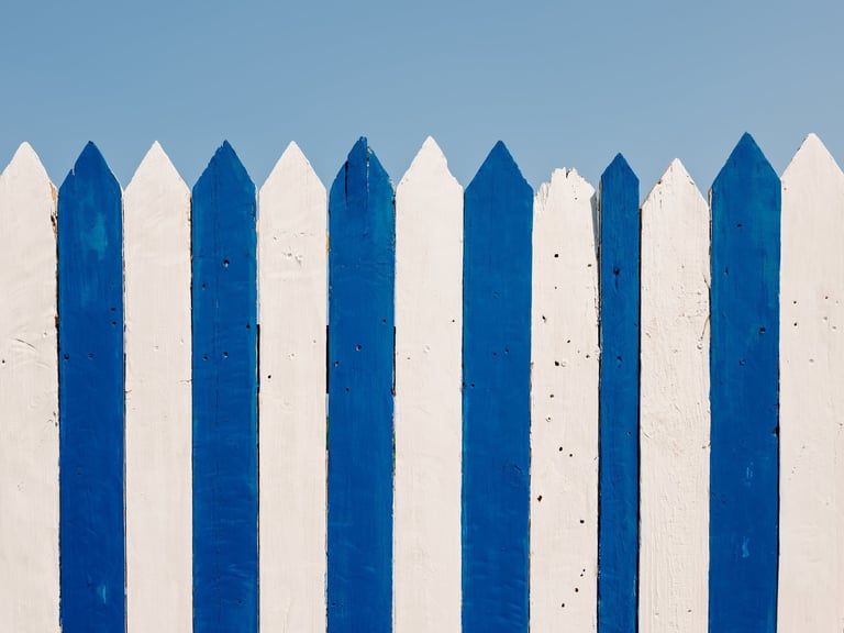 Blue and white vinyl fence