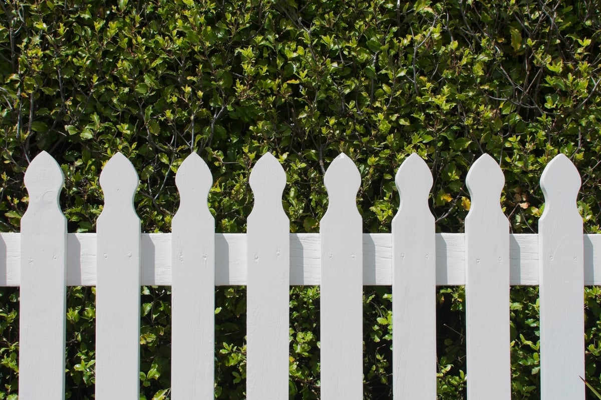 Beautiful white picket fence representing our values